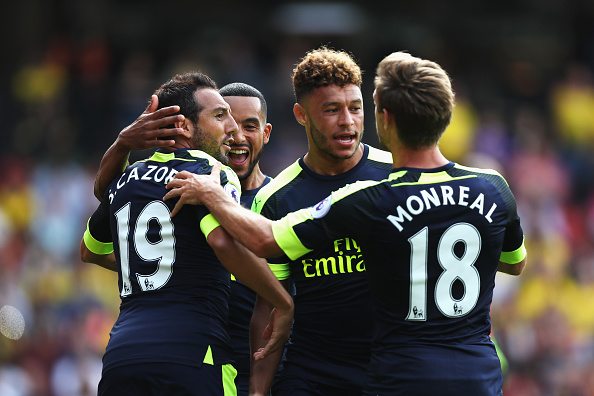 WATFORD, ENGLAND - AUGUST 27: Santi Cazorla of Arsenal celebrates scoring his sides first goal with his team mates during the Premier League match between Watford and Arsenal at Vicarage Road on August 27, 2016 in Watford, England. (Photo by Christopher Lee/Getty Images)
