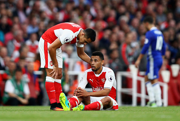 LONDON, ENGLAND - SEPTEMBER 24: Francis Coquelin of Arsneal gets treatment from the medical team during the Premier League match between Arsenal and Chelsea at the Emirates Stadium on September 24, 2016 in London, England. (Photo by Paul Gilham/Getty Images)