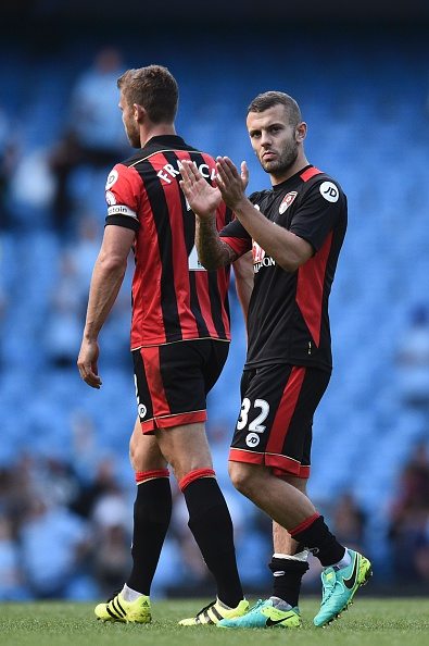 Bournemouth's English midfielder Jack Wilshere (R) applauds the fans at the end of the English Premier League football match between Manchester City and Bournemouth at the Etihad Stadium in Manchester, north west England, on September 17, 2016. | Photo: Oli Scarff / Getty Images