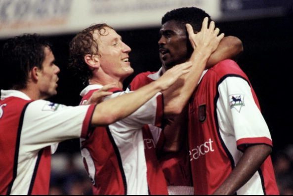 23 Oct 1999: (L to R) Marc Overmars and Ray Parlour congratulate Arsenal team mate Kwankwo Kanu. Picture: Graham Chadwick /Allsport
