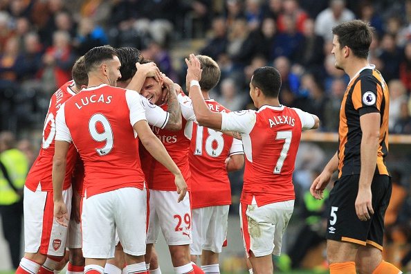Arsenal's Swiss midfielder Granit Xhaka (C) celebrates with teammates after scoring their fourth goal during the English Premier League football match between Hull City and Arsenal at the KCOM Stadium in Kingston upon Hull, north east England on September 17, 2016. / AFP / Lindsey PARNABY / RESTRICTED TO EDITORIAL USE. No use with unauthorized audio, video, data, fixture lists, club/league logos or 'live' services. Online in-match use limited to 75 images, no video emulation. No use in betting, games or single club/league/player publications. / (Photo credit should read LINDSEY PARNABY/AFP/Getty Images)