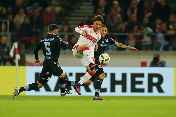 STUTTGART, GERMANY - OCTOBER 21: Takuma Asano (C) of Stuttgart fights for the ball with Fanol Perdedaj (L) and Daylon Claasen (R) of Muenchen during the Second Bundesliga match between VfB Stuttgart and TSV 1860 Muenchen at Mercedes-Benz Arena on October 21, 2016 in Stuttgart, Germany. (Photo by Thomas Niedermueller/Bongarts/Getty Images)