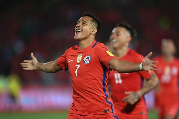 Chile's Alexis Sanchez celebrates after scoring against Uruguay during their 2018 FIFA World Cup qualifier football match in Santiago, on November 15, 2016. / AFP / Martin BERNETTI (Photo credit should read MARTIN BERNETTI/AFP/Getty Images)