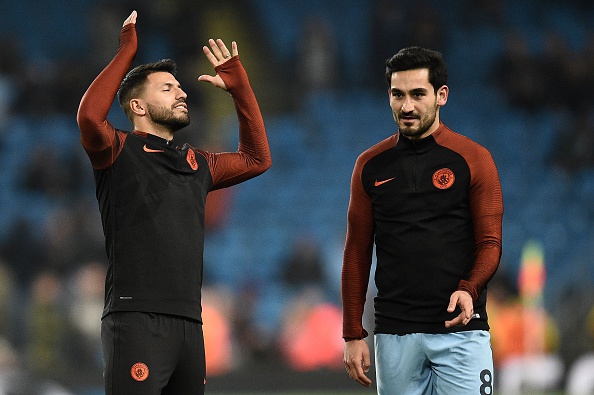 Manchester City's Argentinian striker Sergio Aguero (L) reacts as he warms up with Manchester City's German midfielder Ilkay Gundogan ahead of the UEFA Champions League group C football match between Manchester City and Celtic at the Etihad Stadium in Manchester, northern England, on December 6, 2016. / AFP / Oli SCARFF (Photo credit should read OLI SCARFF/AFP/Getty Images)
