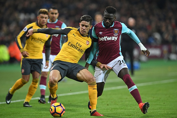 West Ham United's French defender Arthur Masuaku (R) vies with Arsenal's Brazilian defender Gabriel during the English Premier League football match between West Ham United and Arsenal at The London Stadium, in east London on December 3, 2016. / AFP / Justin TALLIS / RESTRICTED TO EDITORIAL USE. No use with unauthorized audio, video, data, fixture lists, club/league logos or 'live' services. Online in-match use limited to 75 images, no video emulation. No use in betting, games or single club/league/player publications. / (Photo credit should read JUSTIN TALLIS/AFP/Getty Images)