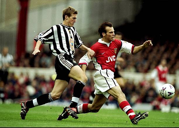 4 Oct 1998:  Fredrik Ljungberg of Arsenal is chased by Paul Dalglish of Newcastle United during the FA Carling Premiership match at Highbury in London. Arsenal won 3-0.  Credit: Stu Forster /Allsport