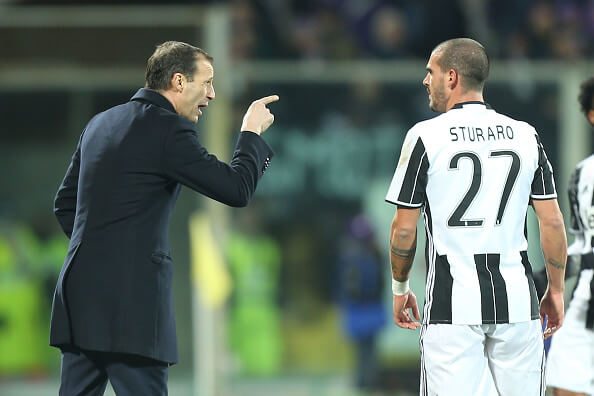 Allegri (L) giving midfielder Sturaro instructions during their game with Fiorentina