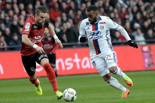 Lacazette (R) in action during Lyon's 2-1 defeat at the hands of Guingamp on Saturday - where he scored their only goal