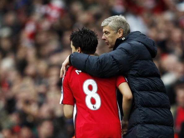Arsenal's French player Samir Nasri (L) is congratulated by Coach Arsene Wenger (R) after he scored the second goal against Manchester United during the Premiership match at The Emirates Stadium in London on November 8, 2008. Nasri scored both Arsenal goals to win the game 2-1. (ADRIAN DENNIS/AFP/Getty Images)