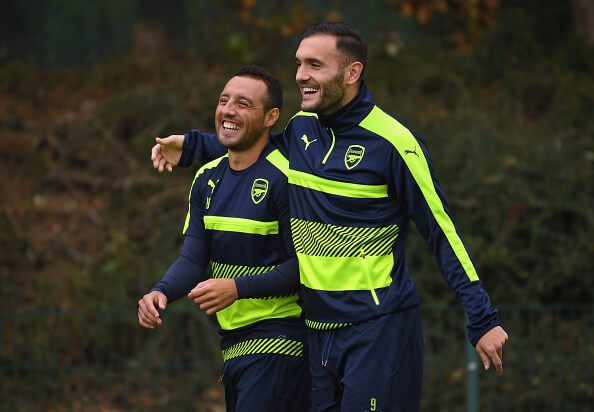 ST ALBANS, ENGLAND - SEPTEMBER 27: Santi Cazorla (L) of Arsenal laughs with Lucas Perez (R) during an Arsenal training session ahead of the Champions League Group A match between Arsenal and Basel at London Colney on September 27, 2016 in St Albans, England. (Photo by Mike Hewitt/Getty Images)