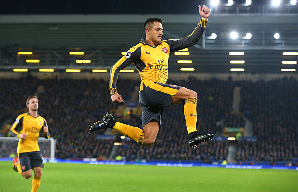 Alexis celebrating his set-piece strike against Everton last December, his first in five meetings against the Toffees