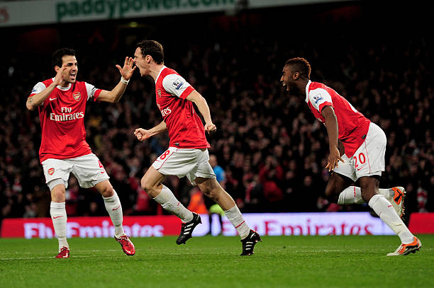 LONDON, ENGLAND - FEBRUARY 23: Sebastien Squillaci (C) of Arsenal celebrates with teammates Cesc Fabregas (L) and Johan Djourou (R) after he scores the opening goal during the Barclays Premier League match between Arsenal and Stoke City at the Emirates Stadium on February 23, 2011 in London, England. (Photo by Shaun Botterill/Getty Images)