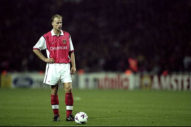 27 Oct 1999: Dennis Bergkamp of Arsenal lines up a free-kick during the UEFA European Champions League Group B match against Fiorentina played at Wembley Stadium, London. The game finished in a 1-0 away win for Fiorentina and saw the elimination of Arsenal from the second phase. (Alex Livesey/Allsport)