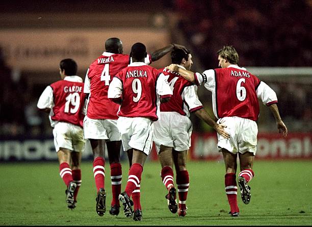 30 Sep 1998: Martin Keown of Arsenal is congratulated by his team-mates after scoring a goal during the UEFA Champions League match against Panathinaikos played at Wembley Stadium in London, England. The match finished in a 2-1 victory for Arsenal. (Shaun Botterill /Allsport)