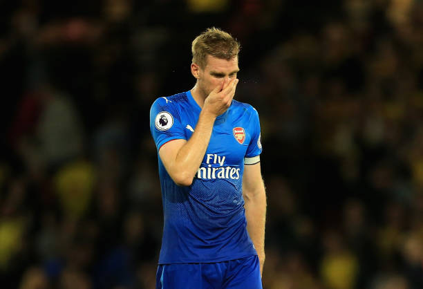 WATFORD, ENGLAND - OCTOBER 14: Per Mertesacker of Arsenal looks dejected in defence the Premier League match between Watford and Arsenal at Vicarage Road on October 14, 2017 in Watford, England. (Photo by Stephen Pond/Getty Images)