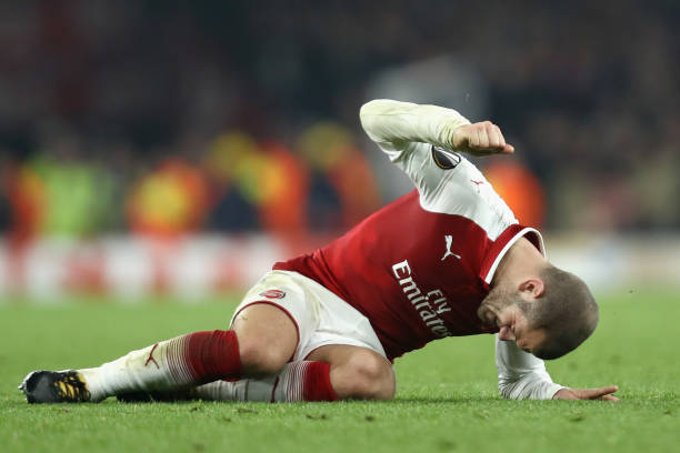 LONDON, ENGLAND - NOVEMBER 02: Jack Wilshere of Arsenal reacts to going down injured during the UEFA Europa League group H match between Arsenal FC and Crvena Zvezda at Emirates Stadium on November 2, 2017 in London, United Kingdom. (Photo by Bryn Lennon/Getty Images)