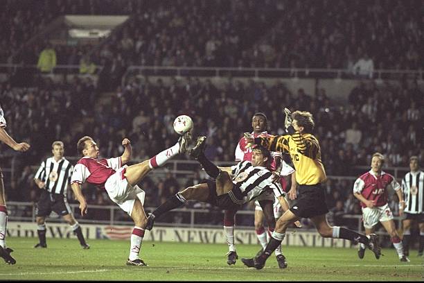 30 Nov 1996: A goalmouth scramble sees David Platt of Arsenal (left) clear the ball ahead of the acrobatic Phillipe Albert of Newcastle and the incoming goalkeeper John Lukic (right) during the FA Carling Premier league match between Newcastle United and Arsenal at St.James'' Park in Newcastle. Arsenal won 1-2. Mandatory Credit: Ross Kinnaird/Allsport