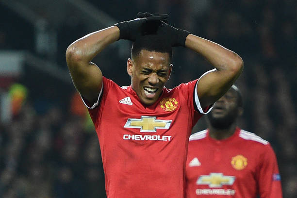 Manchester United's French striker Anthony Martial reacts after having his penalty kick saved during the UEFA Champions League Group A football match between Manchester United and Benfica at Old Trafford in Manchester, north west England on October 31, 2017. (OLI SCARFF/AFP/Getty Images)