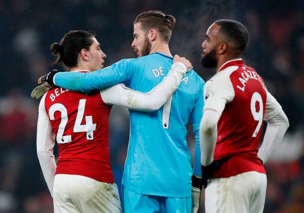 Arsenal's Spanish defender Hector Bellerin (L) congratulates Manchester United's Spanish goalkeeper David de Gea (C) after the English Premier League football match between Arsenal and Manchester United at the Emirates Stadium in London on December 2, 2017. Manchester United won 3-1. Picture: ADRIAN DENNIS/AFP/Getty Images