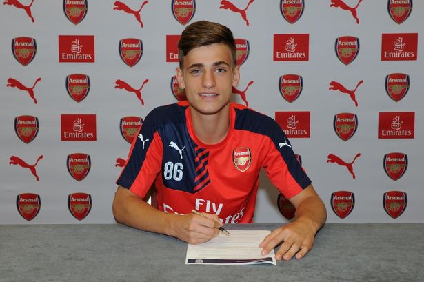 Vlad Dragomir signing his Arsenal contract. Picture: Getty Images
