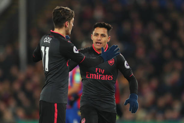 LONDON, ENGLAND - DECEMBER 28: Alexis Sanchez of Arsenal celebrates as he scores their second goal with Mesut Ozil during the Premier League match between Crystal Palace and Arsenal at Selhurst Park on December 28, 2017 in London, England. (Photo by Catherine Ivill/Getty Images)