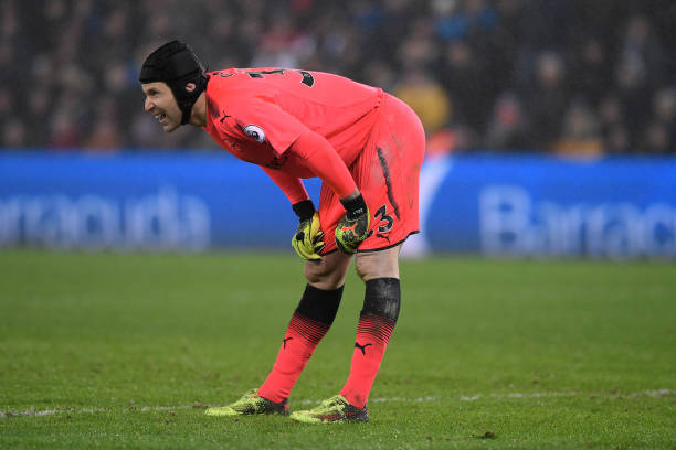SWANSEA, WALES - JANUARY 30: Petr Cech of Arsenal reacts after Jordan Ayew of Swansea City (not pictured) scored his sides second goal during the Premier League match between Swansea City and Arsenal at Liberty Stadium on January 30, 2018 in Swansea, Wales. (Photo by Stu Forster/Getty Images)