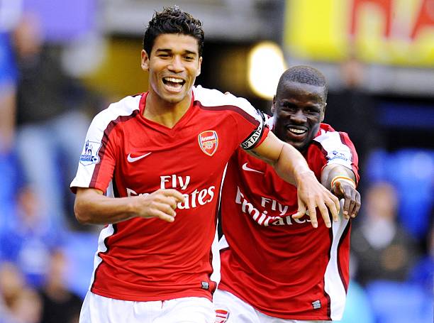 LIVERPOOL, ENGLAND - AUGUST 15: Da Silva Eduardo of Arsenal celebrates with teammate Emmanuel Eboue (R) after scoring his team's sixth goal during the Barclays Premier League match between Everton and Arsenal at Goodison Park on August 15, 2009 in Liverpool, England. (Photo by Michael Regan/Getty Images)