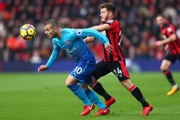 BOURNEMOUTH, ENGLAND - JANUARY 14: Jack Wilshere of Arsenal and Ryan Fraser of AFC Bournemouth battles for possesion during the Premier League match between AFC Bournemouth and Arsenal at Vitality Stadium on January 14, 2018 in Bournemouth, England. (Photo by Clive Rose/Getty Images)