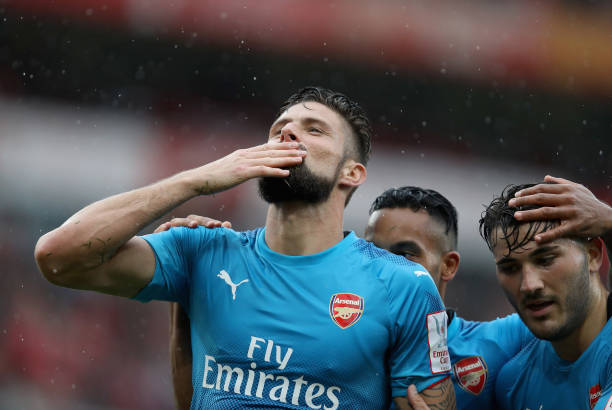LONDON, ENGLAND - JULY 29: Olivier Giroud of Arsenal celebrates with teammates Theo Walcott and Sead Kolainac after scoring 4-2 during the pre-season friendly match between Arsenal v SL Benfica during the Emirates Cup at Emirates Stadium on July 29, 2017 in London, England. (Photo by Linnea Rheborg/Getty Images)