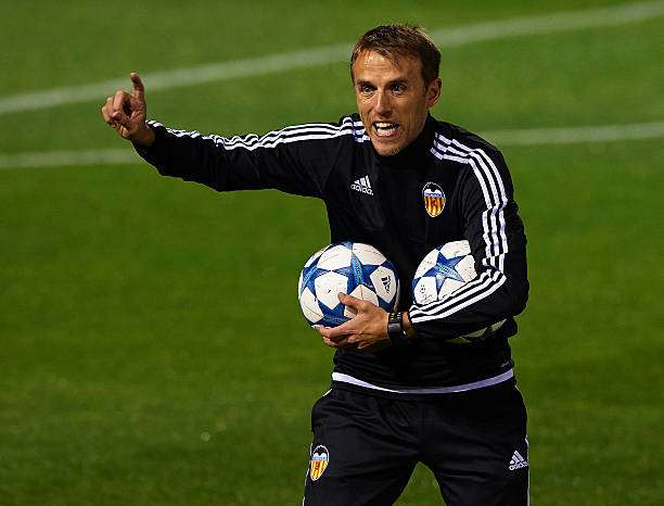 VALENCIA, SPAIN - DECEMBER 07: Valencia CF assistant coach Phil Neville gives instructions during a training session ahead of Wednesday's UEFA Champions League Group H match against Olympique Lyonnais at Paterna Training Centre on December 07, 2015 in Valencia, Spain. (Photo by Manuel Queimadelos Alonso/Getty Images)