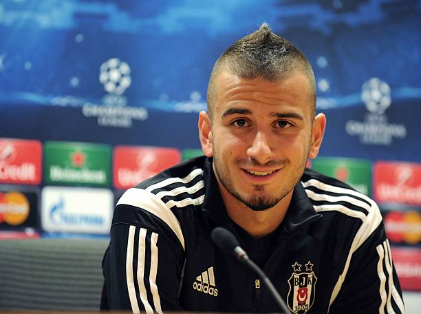 Besiktas' Netherlands-born Turkish midfielder Oguzhan Ozyakup answers questions during a press conference at Arsenal's Emirates Stadium in north London, on August 26, 2014, on the eve of their UEFA Champions League second-leg play-off match against Arsenal. AFP PHOTO/OLLY GREENWOOD