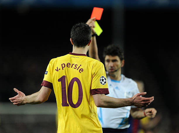 BARCELONA, SPAIN - MARCH 08: Robin van Persie of Arsenal reacts as referee Massimo Busacca shows his a red card during the UEFA Champions League round of 16 second leg match between Barcelona and Arsenal on March 8, 2011 in Barcelona, Spain. (Photo by Jasper Juinen/Getty Images)