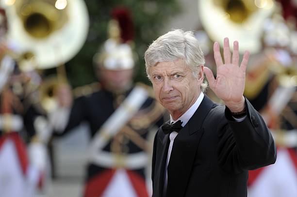 Arsenal's French coach Arsene Wenger waves as he arrive for a state dinner at the Elysee presidential palace in Paris, on June 6, 2014, following the international D-Day commemoration ceremony on the beach of Ouistreham, Normandy, marking the 70th anniversary of the World War II Allied landings in Normandy. AFP PHOTO / FRED DUFOUR