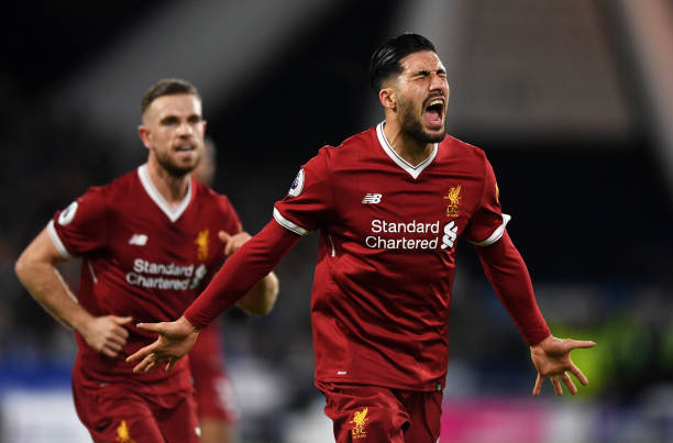 HUDDERSFIELD, ENGLAND - JANUARY 30: Emre Can of Liverpool (R) celebrates as he scores their first goal with Jordan Henderson during the Premier League match between Huddersfield Town and Liverpool at John Smith's Stadium on January 30, 2018 in Huddersfield, England. (Photo by Gareth Copley/Getty Images)