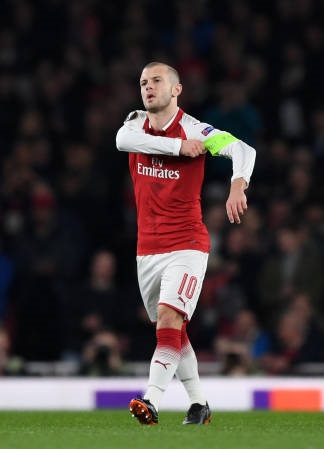 LONDON, ENGLAND - MARCH 15: Jack Wilshere of Arsenal puts on the Captains armband after the injury of Laurent Koscielny during the UEFA Europa League Round of 16 Second Leg match between Arsenal and AC Milan at Emirates Stadium on March 15, 2018 in London, England. (Photo by Shaun Botterill/Getty Images)
