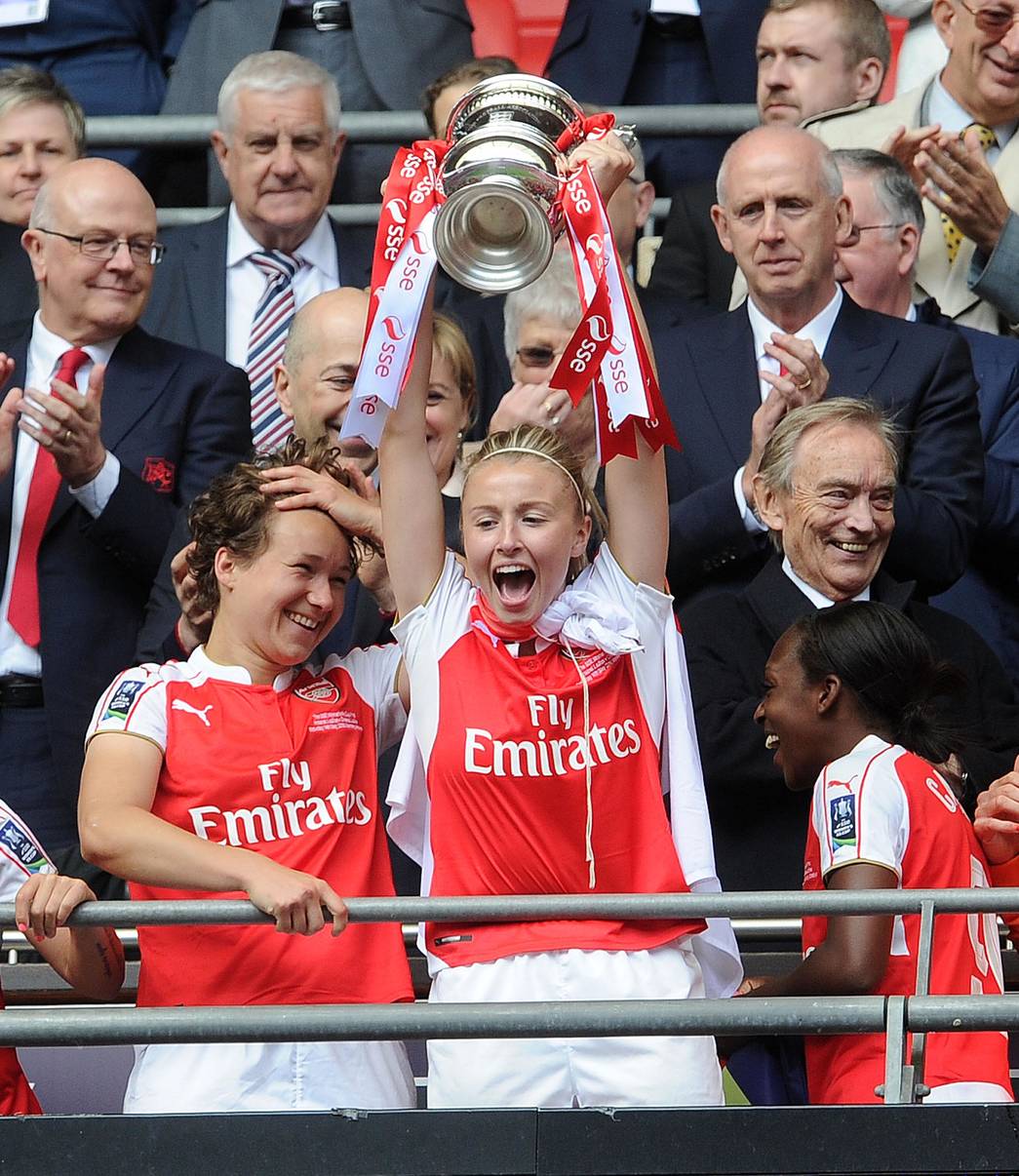 LONDON, ENGLAND - MAY 14: Leah Williamson of Arsenal Ladies lifts the FA Cup Trophy after the match between Arsenal Ladies and Chelsea Ladies at Wembley Stadium on May 14, 2016 in London, England. (Photo by David Price/Arsenal FC via Getty Images) *** Local Caption *** Leah Williamson