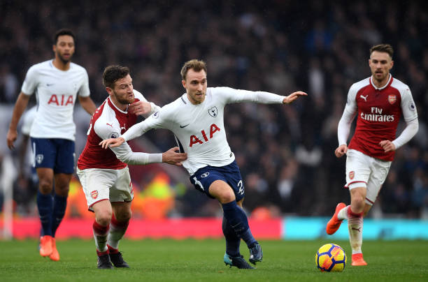 LONDON, ENGLAND - NOVEMBER 18: Shkodran Mustafi of Arsenal and Christian Eriksen of Tottenham Hotspur in action during the Premier League match between Arsenal and Tottenham Hotspur at Emirates Stadium on November 18, 2017 in London, England. (Photo by Mike Hewitt/Getty Images)