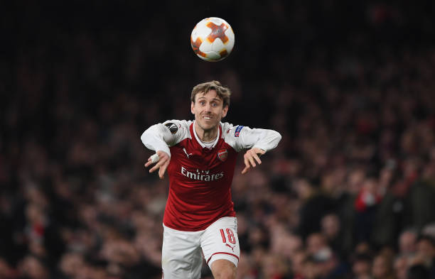 LONDON, ENGLAND - MARCH 15: Nacho Monreal of Arsenal takes a throw in during the UEFA Europa League Round of 16 second leg match between Arsenal and AC Milan at Emirates Stadium on March 15, 2018 in London, England. (Photo by Shaun Botterill/Getty Images)