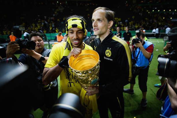 BERLIN, GERMANY - MAY 27: Pierre-Emerick Aubameyang and Thomas Tuchel of Dortmund celebrate with the trophy after winning the DFB Cup Final 2017 between Eintracht Frankfurt and Borussia Dortmund at Olympiastadion on May 27, 2017 in Berlin, Germany. (Photo by Matthias Hangst/Bongarts/Getty Images)