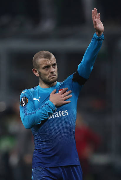 MILAN, ITALY - MARCH 08: Jack Wilshere of Arsenal acknowledges the fans after the UEFA Europa League Round of 16 match between AC Milan and Arsenal at the San Siro on March 8, 2018 in Milan, Italy. (Photo by Catherine Ivill/Getty Images)