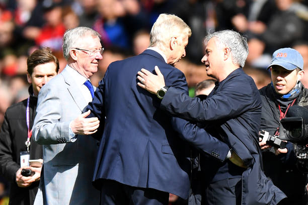 Arsenal's French manager Arsene Wenger (C) is greeted by Manchester United's former manager Alex Ferguson (L) and Manchester United's Portuguese manager Jose Mourinho (R) during a presentation before the English Premier League football match between Manchester United and Arsenal at Old Trafford in Manchester, north west England, on April 29, 2018. - Arsene Wenger is unsure of the welcome he will receive on his final visit to Old Trafford as Arsenal boss on Sunday after many 'great battles' against Manchester United during his two decades in charge. (Photo by Paul ELLIS / AFP)