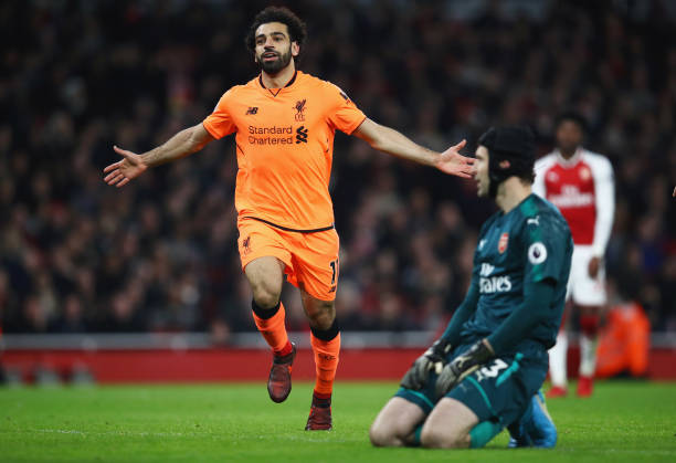 LONDON, ENGLAND - DECEMBER 22: Mohamed Salah of Liverpool celebrates as he scores their second goal as Petr Cech of Arsenal looks dejected during the Premier League match between Arsenal and Liverpool at Emirates Stadium on December 22, 2017 in London, England. (Photo by Julian Finney/Getty Images)