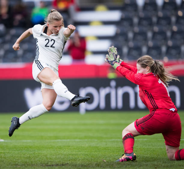 GROSSASPACH, GERMANY - OCTOBER 24: Tabea Kemme of Germany scores her team's third goal against goalkeeper Monika Biskopstoe of Faroe Islands during the 2019 FIFA Women's World Championship Qualifier match between Germany and Faroe Islands at mechatronik Arena on October 24, 2017 in Grossaspach, Germany. (Photo by Simon Hofmann/Bongarts/Getty Images)