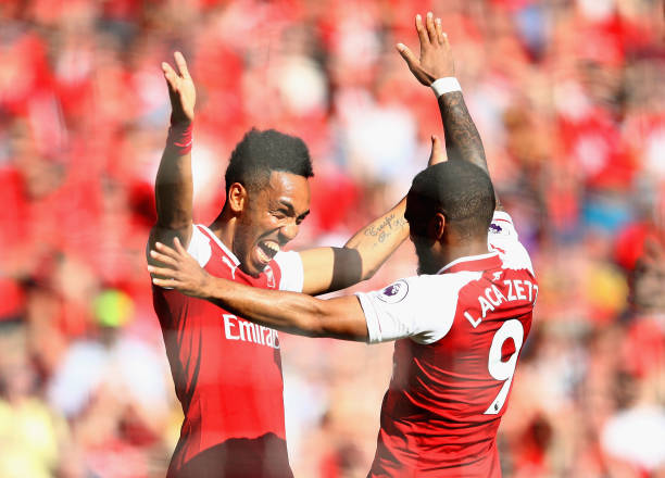 LONDON, ENGLAND - MAY 06: Pierre-Emerick Aubameyang of Arsenal celebrates after scoring his sides first goal with Alexandre Lacazette of Arsenal during the Premier League match between Arsenal and Burnley at Emirates Stadium on May 6, 2018 in London, England. (Photo by Clive Mason/Getty Images)