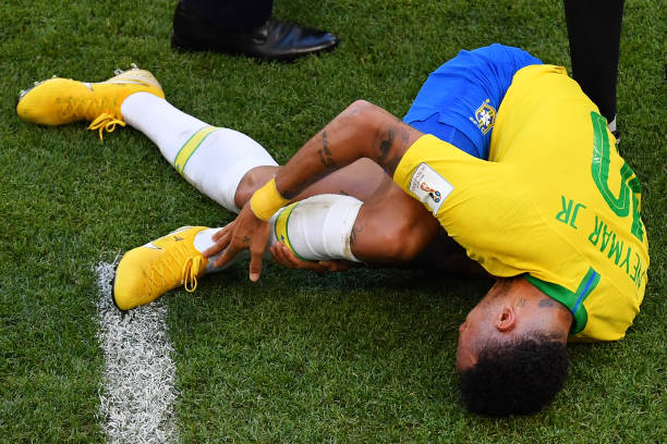 SAMARA, RUSSIA - JULY 02: Neymar Jr of Brazil goes down injured during the 2018 FIFA World Cup Russia Round of 16 match between Brazil and Mexico at Samara Arena on July 2, 2018 in Samara, Russia. (Photo by Hector Vivas/Getty Images)