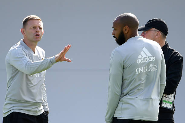 Belgium's assistant coach Thierry Henry (front R) speaks with assistant coach Graeme Jones (L) during a training session of Belgium's national football team at the Guchkovo Stadium in Dedovsk, outside Moscow, on July 8, 2018, ahead of their Russia 2018 World Cup semi-final football match against France. (Photo by FRANCK FIFE / AFP)