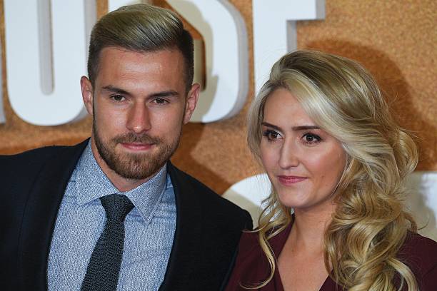 Arsenal's Welsh football player Aaron Ramsey (L) poses with his wife Colleen Rowland upon arrival to attend the European premiere of the film 'Jack Reacher: Never Go Back' in central London on October 20, 2016. / AFP / Justin TALLIS (Photo credit should read JUSTIN TALLIS/AFP/Getty Images)