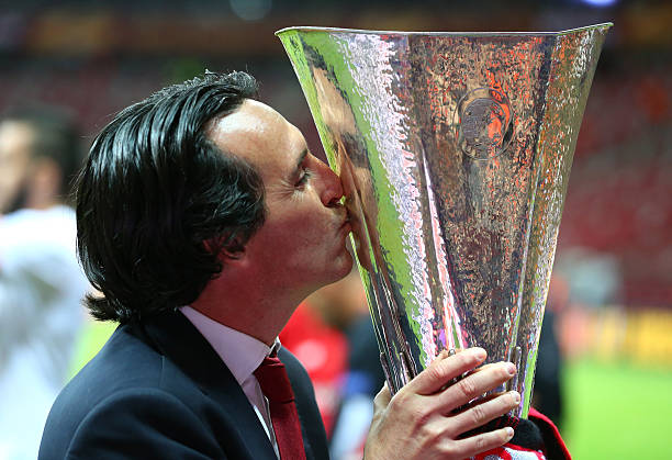 WARSAW, POLAND - MAY 27: Unai Emery, coach of Sevilla kisses the trophy after the UEFA Europa League Final match between FC Dnipro Dnipropetrovsk and FC Sevilla on May 27, 2015 in Warsaw, Poland. (Photo by Martin Rose/Getty Images)
