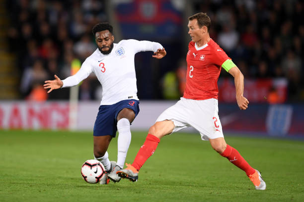 LEICESTER, ENGLAND - SEPTEMBER 11: Danny Rose of England battles with Stephan Lichtsteiner of Switzerland during the international friendly match between England and Switzerland at The King Power Stadium on September 11, 2018 in Leicester, United Kingdom. (Photo by Laurence Griffiths/Getty Images)