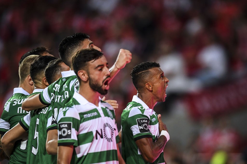 Sporting's forward Nani (R) celebrates a goal after shooting a penalty kick during the Portuguese league football match between SL Benfica and Sporting CP at the Luz stadium in Lisbon on August 25, 2018. (Photo by PATRICIA DE MELO MOREIRA / AFP) (Photo credit should read PATRICIA DE MELO MOREIRA/AFP/Getty Images)